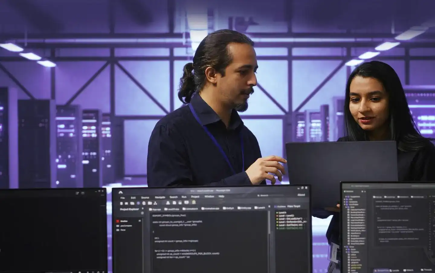 Two people engaged in a conversation about DevOps tasks, symbolizing DevOps consulting services
