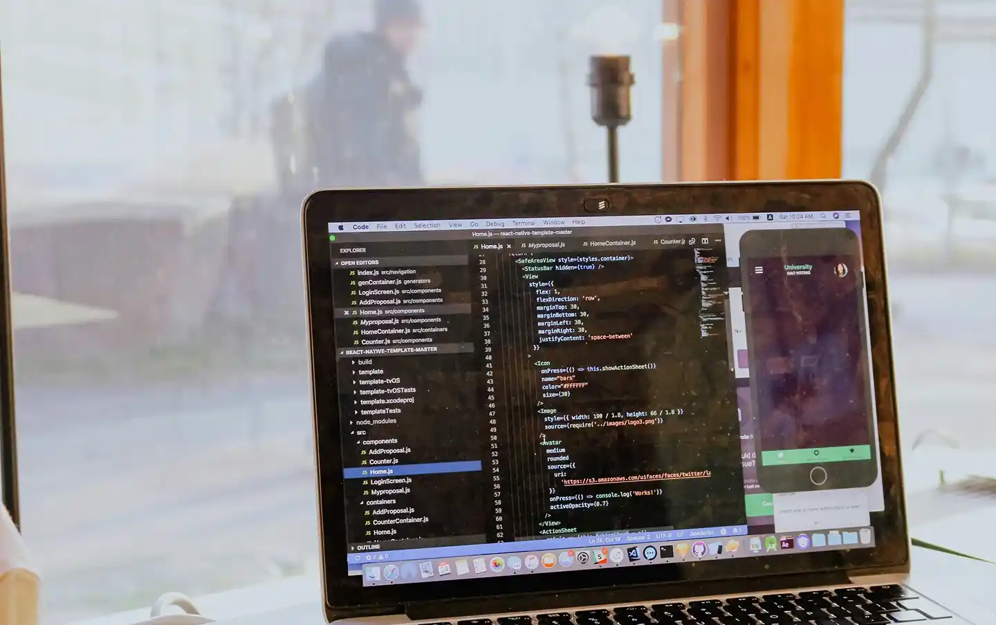 Laptop screen showing mobile app code during development, illustrating mobile app development services built for custom cross-platform solutions.