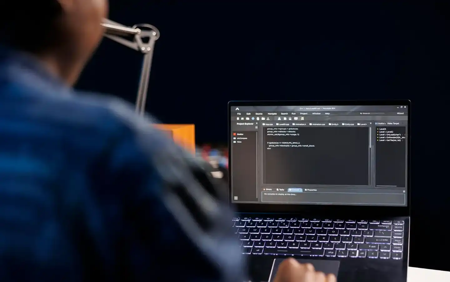 Developer building a custom API integration on a laptop, illustrating custom API development and integration services built for connecting business systems