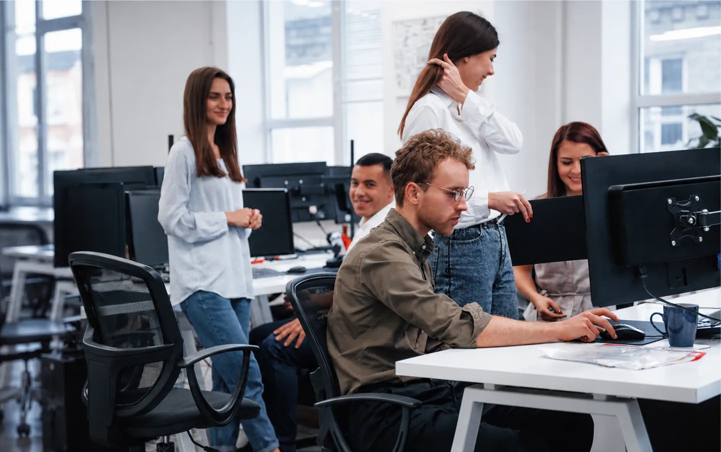 A team of engineers working on custom software